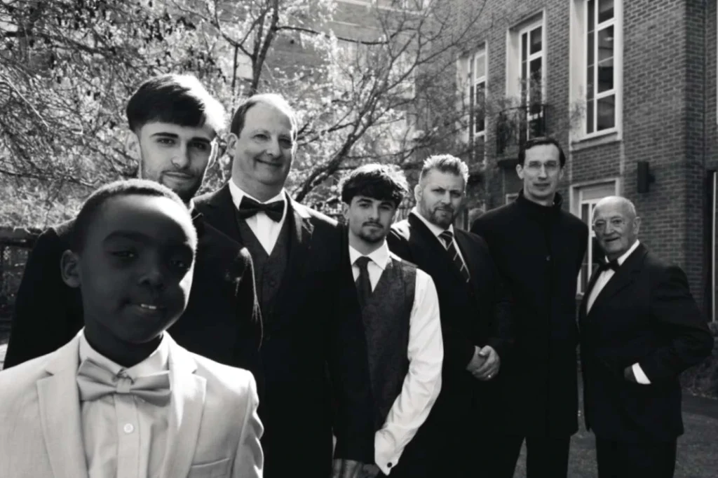Groom and his groomsmen posing for the photographer