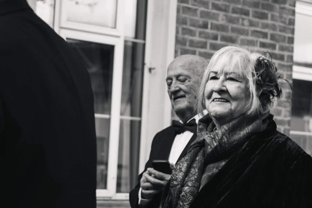 Grooms parents talking to Guests
