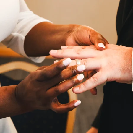 wedding ring exchange ceremony maidenhead berkshire documentary wedding photographer close up hands bride placing ring on groom finger