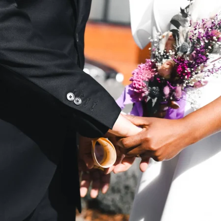 Close-up of wedding ring exchange during ceremony at Maidenhead Registry Office Berkshire by documentary wedding photographer